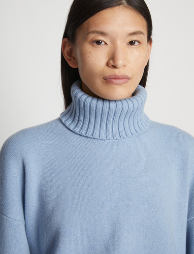 Detail image of model wearing Doubleface Cashmere Oversized Turtleneck in light blue