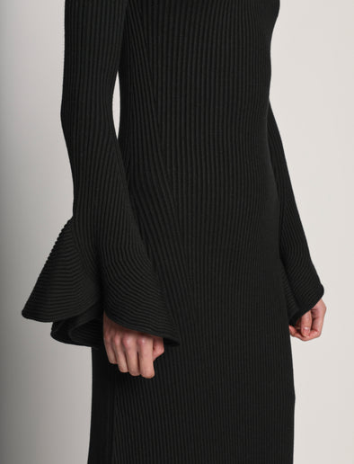 Detail image of model wearing Fluted Rib Knit Dress in black