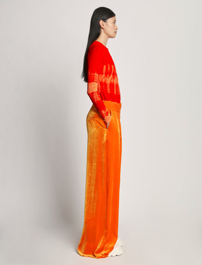 Side image of model wearing Viscose Knit Tie Dye Top in orange multi