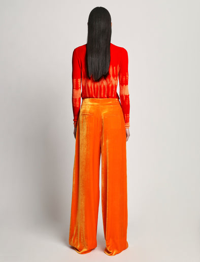 Back image of model wearing Viscose Knit Tie Dye Top in orange multi