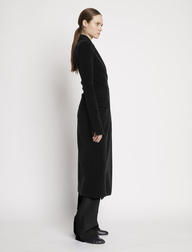 Proenza Schouler side image of model wearing Bi-Stretch Crepe Wrap Coat in black