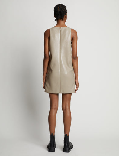 Back image of model wearing Vinyl V-Neck Shift Dress in fawn
