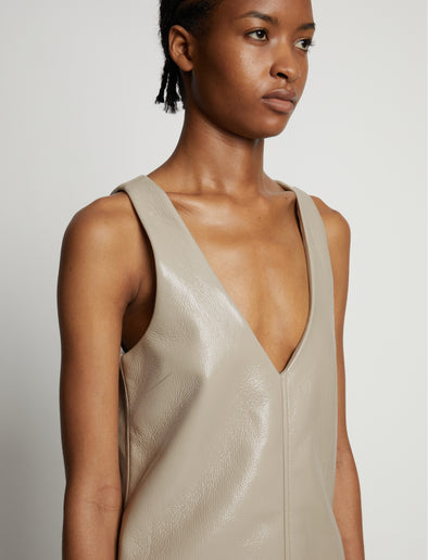 Detail image of model wearing Vinyl V-Neck Shift Dress in fawn