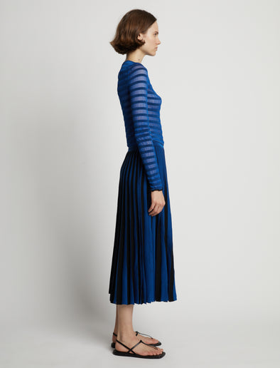 Side image of model wearing Sheer Stripe Knit Skirt in cerulean/black