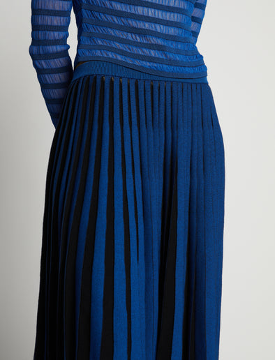Detail image of model wearing Sheer Stripe Knit Skirt in cerulean/black