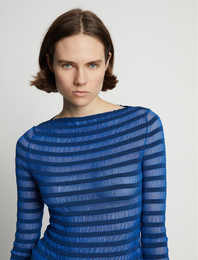 Detail image of model wearing Sheer Stripe Sweater in cerulean/black