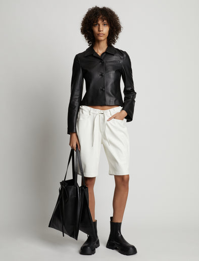 Front image of model wearing Faux Leather Shorts in off white