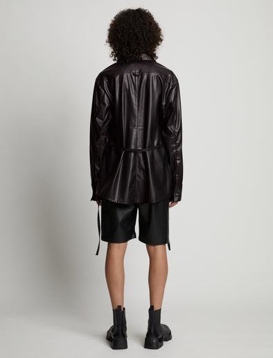 Back image of model wearing Faux Leather Shirt Jacket in black