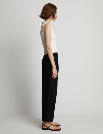Side image of model wearing Sweatshirt Tank Top in off white