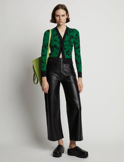 Front image of model wearing Knit Floral Cardigan in green/black