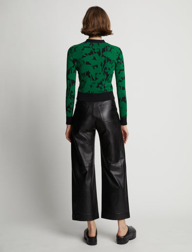 Back image of model wearing Knit Floral Cardigan in green/black