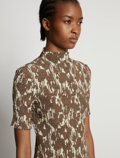 Detail image of model wearing Viscose Flou Smocked Top in buttercream/fawn