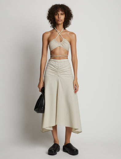 Front image of model wearing Gingham Halter Bralette in buttercream/fawn
