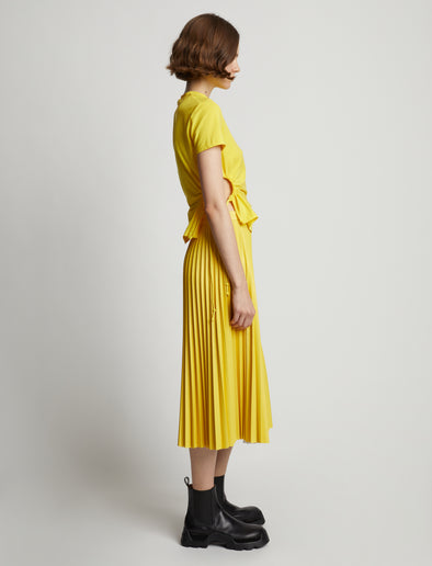 Side image of model wearing Side Slit T-Shirt in sun