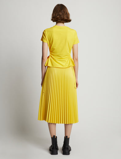 Back image of model wearing Side Slit T-Shirt in sun
