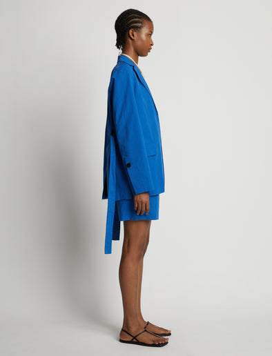 Side image of model wearing Cotton Linen Shorts in cerulean