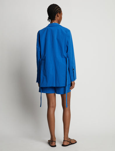 Back image of model wearing Cotton Linen Shorts in cerulean