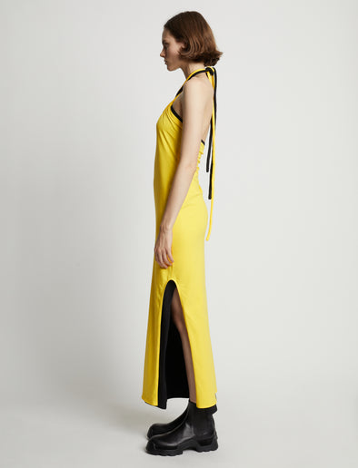 Side image of model wearing Halter Knit Jersey Dress in sun
