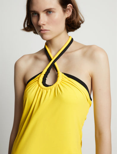 Detail image of model wearing Halter Knit Jersey Dress in sun