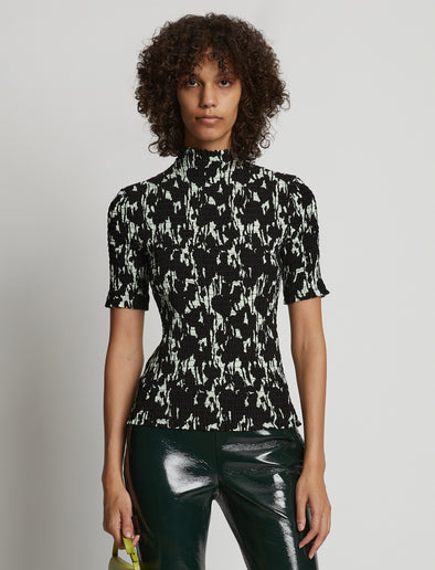 Cropped front image of model wearing Viscose Flou Smocked Top in mint/black