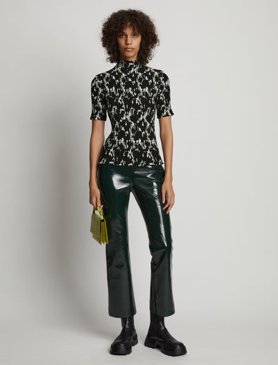Front image of model wearing Viscose Flou Smocked Top in mint/black