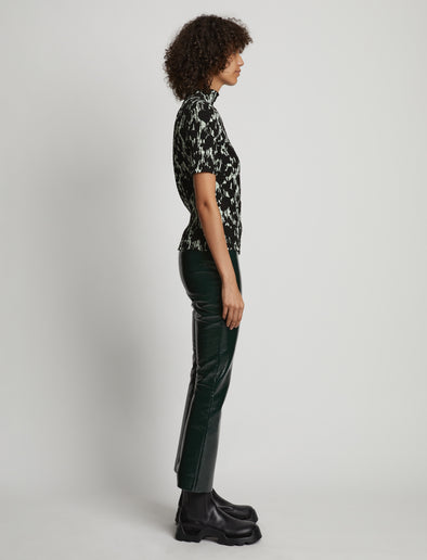 Side image of model wearing Viscose Flou Smocked Top in mint/black