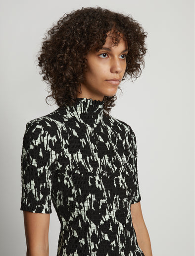 Detail image of model wearing Viscose Flou Smocked Top in mint/black