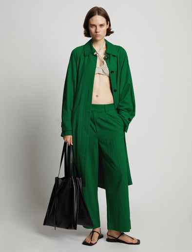 Front image of model wearing Drapey Suiting Trench Coat in green