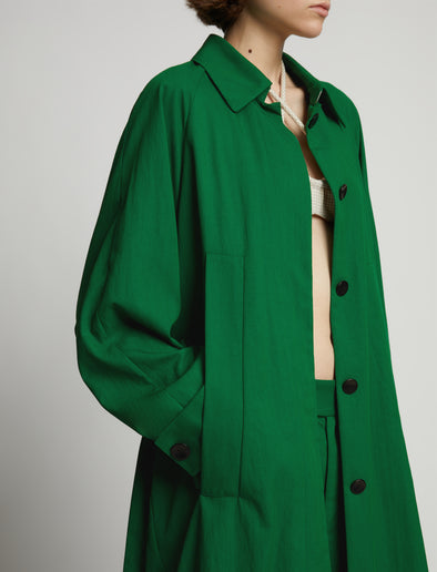 Detail image of model wearing Drapey Suiting Trench Coat in green