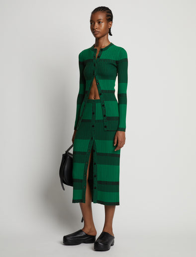 Side image of model wearing Mini Stripe Cardigan in green/black
