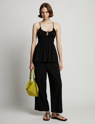 Front image of model wearing Drapey Suiting Ruched Top in black