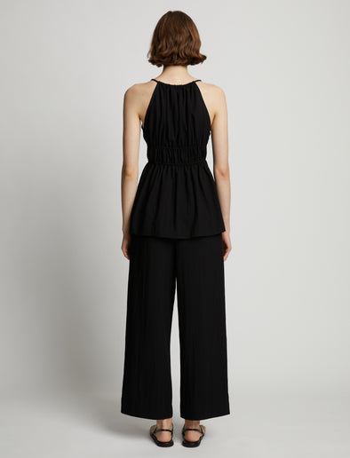 Back image of model wearing Drapey Suiting Ruched Top in black