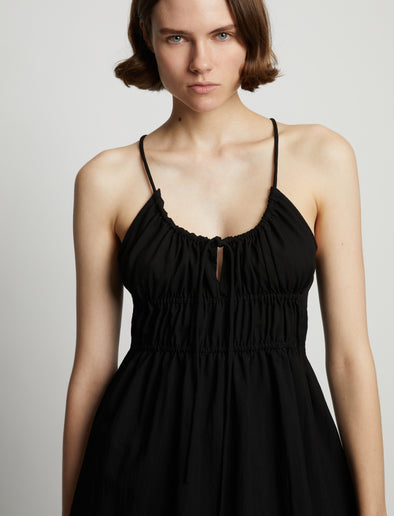Detail image of model wearing Drapey Suiting Ruched Top in black