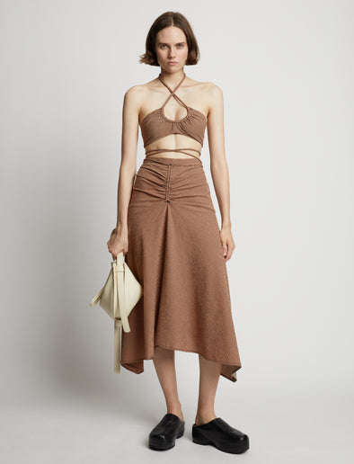 Front image of model wearing Gingham Halter Bralette in coral/black