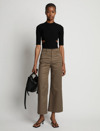 Front image of model wearing Rib Knit Cut Out Sweater in black
