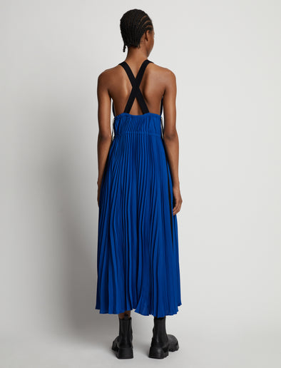 Back image of model wearing Broomstick Pleated Tank Dress in cerulean