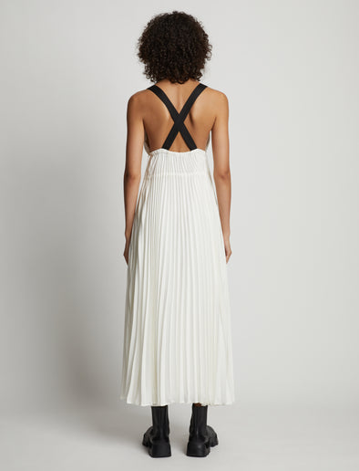 Back image of model wearing Broomstick Pleated Tank Dress in off white
