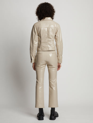 Back image of model wearing Vinyl Cropped Jacket in fawn