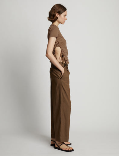Side image of model wearing Side Slit T-Shirt in coffee