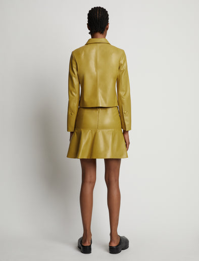 Back image of model wearing Leather Ruffle Mini Skirt in sulphur