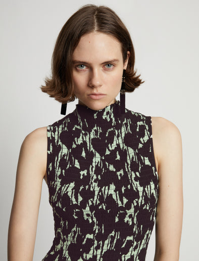 Detail image of model wearing Printed Smocked Mini Dress in mint/black