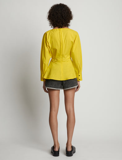 Back image of model wearing Poplin V-Neck Top in sun