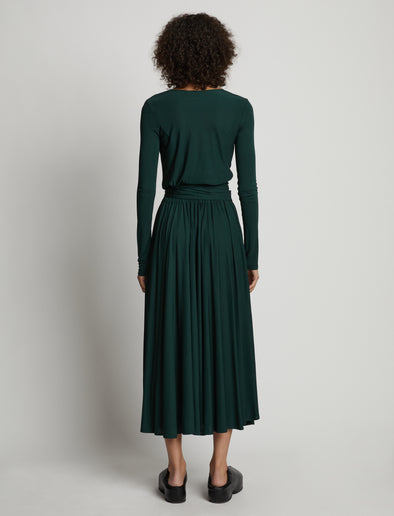 Back image of model wearing Matte Crepe Wrap Dress in pine