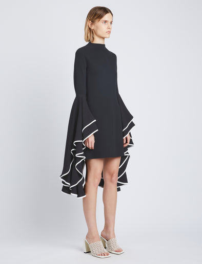 Side image of model wearing Viscose Crepe Dress in black
