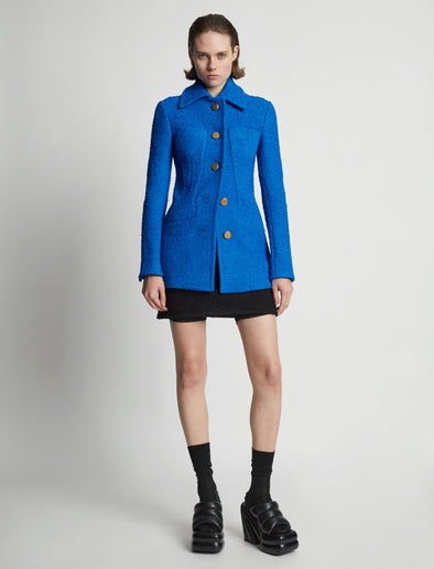 Front image of model wearing Boucle Tweed Jacket in turquoise