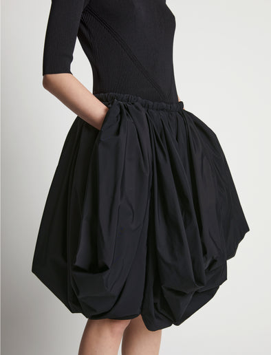 Detail image of model wearing Technical Nylon Skirt in black