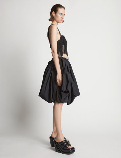 Side image of model wearing Technical Nylon Fringe Bra in black