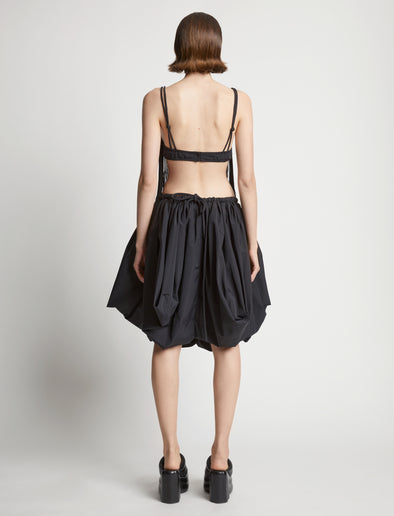 Back image of model wearing Technical Nylon Fringe Bra in black