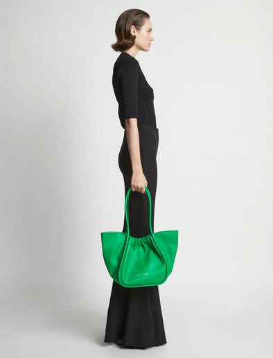 Image of model wearing Large Ruched tote in BOTTLE GREEN