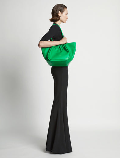 Image of model wearing Large Ruched tote in BOTTLE GREEN